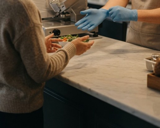 Asking for fresh gloves is a reasonable food-safety request, especially when allergies are involved.