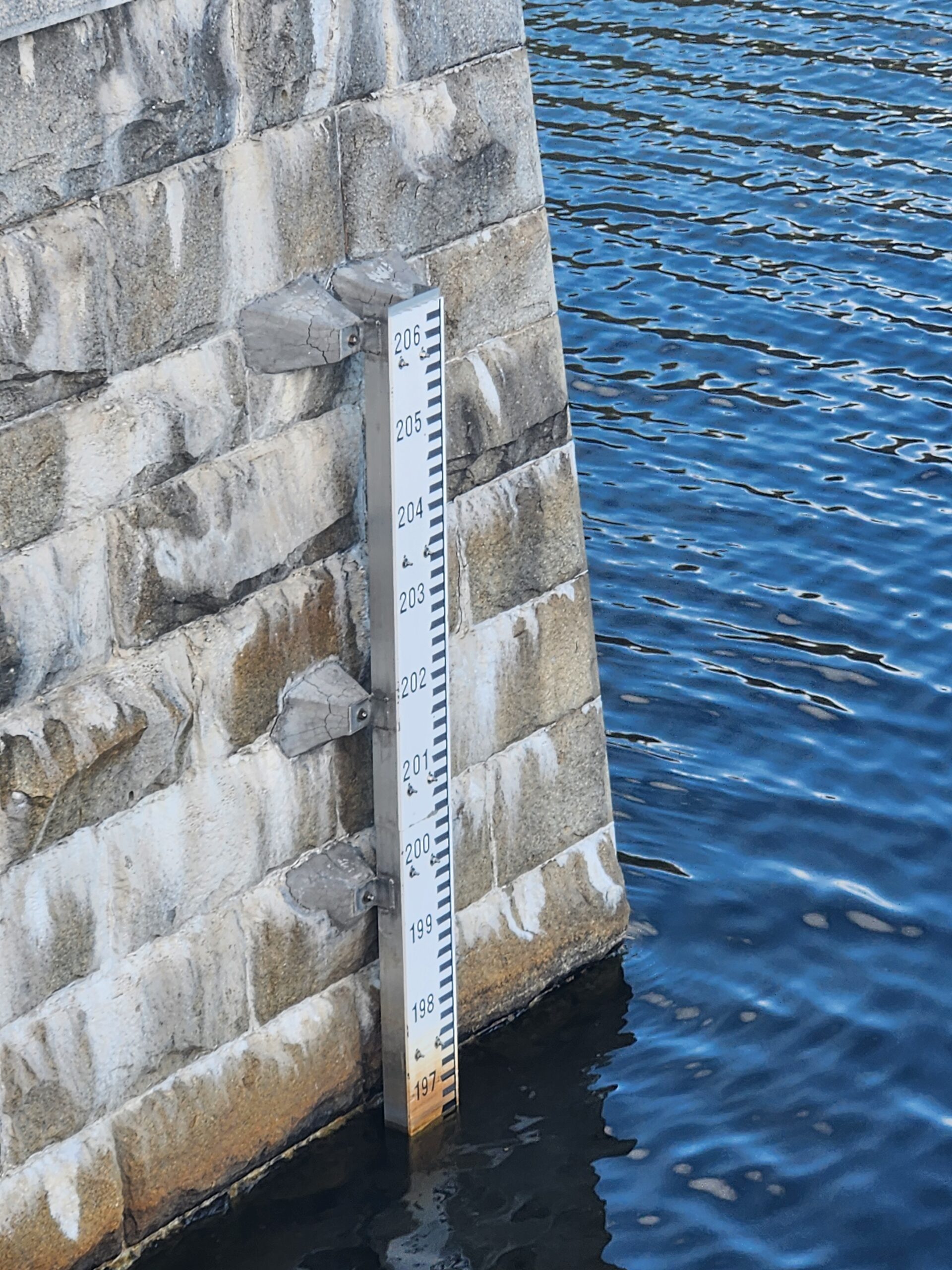 Close-up of the carved stone face of the historic Croton Dam