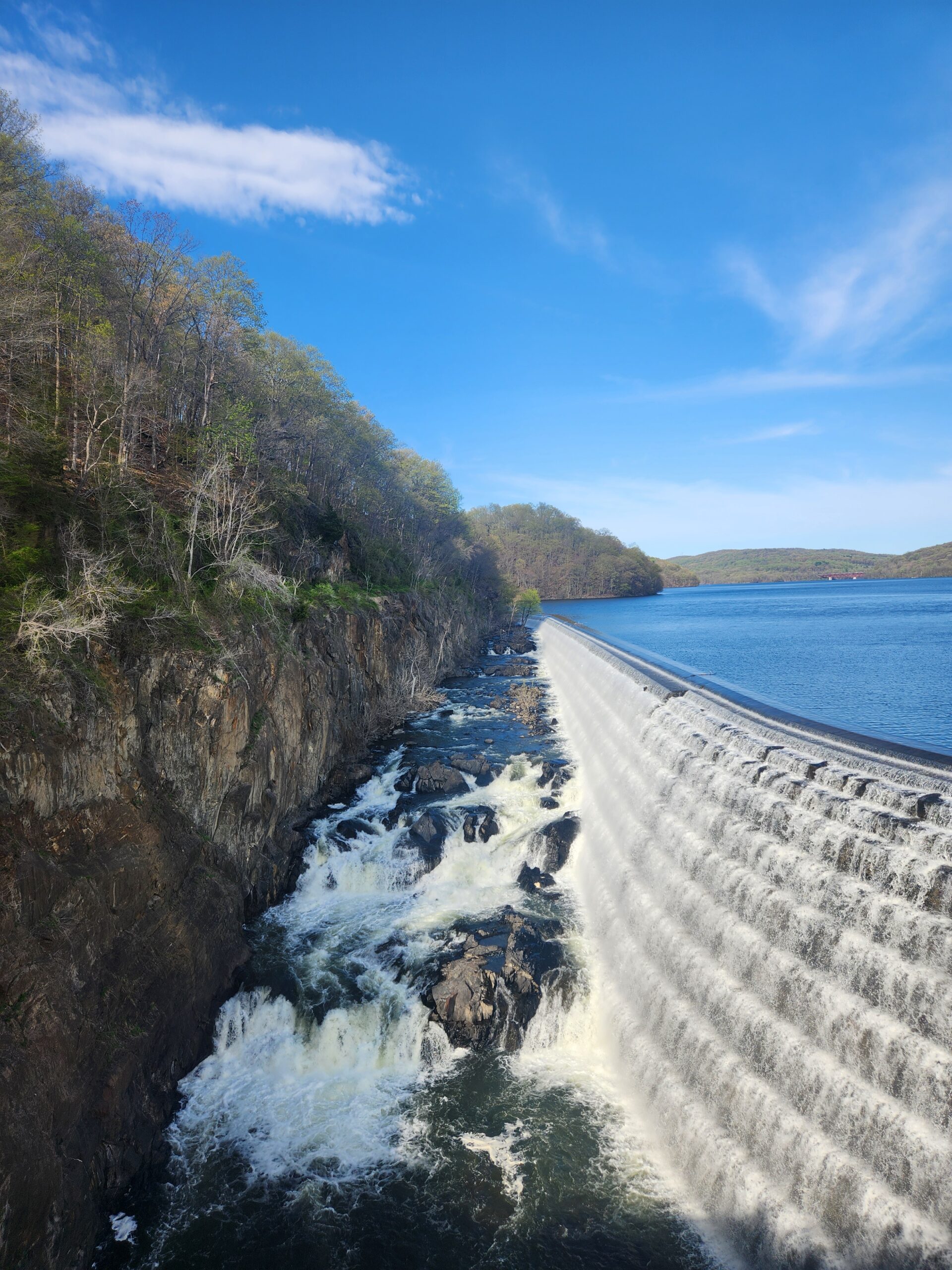 Looking up at the towering 200-foot New Croton Dam from the base in Croton Gorge Park